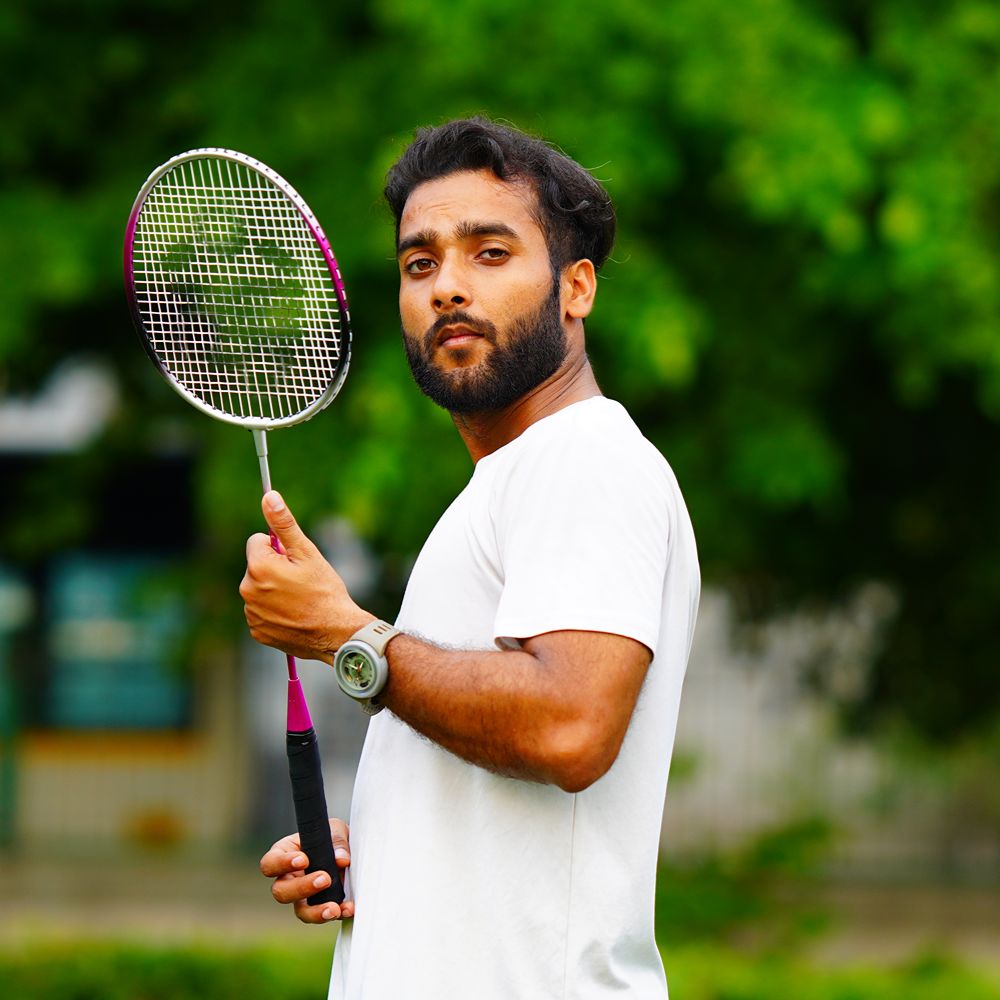 portrait-badminton-player-holding-badminton-racket (1)